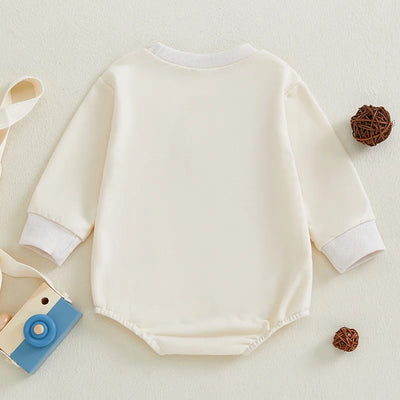 Niemowlęce body z długim rękawem i świątecznym napisem