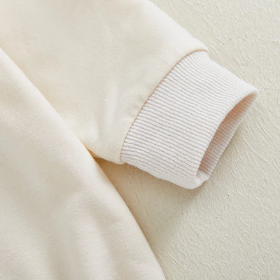 Niemowlęce body z długim rękawem i świątecznym napisem